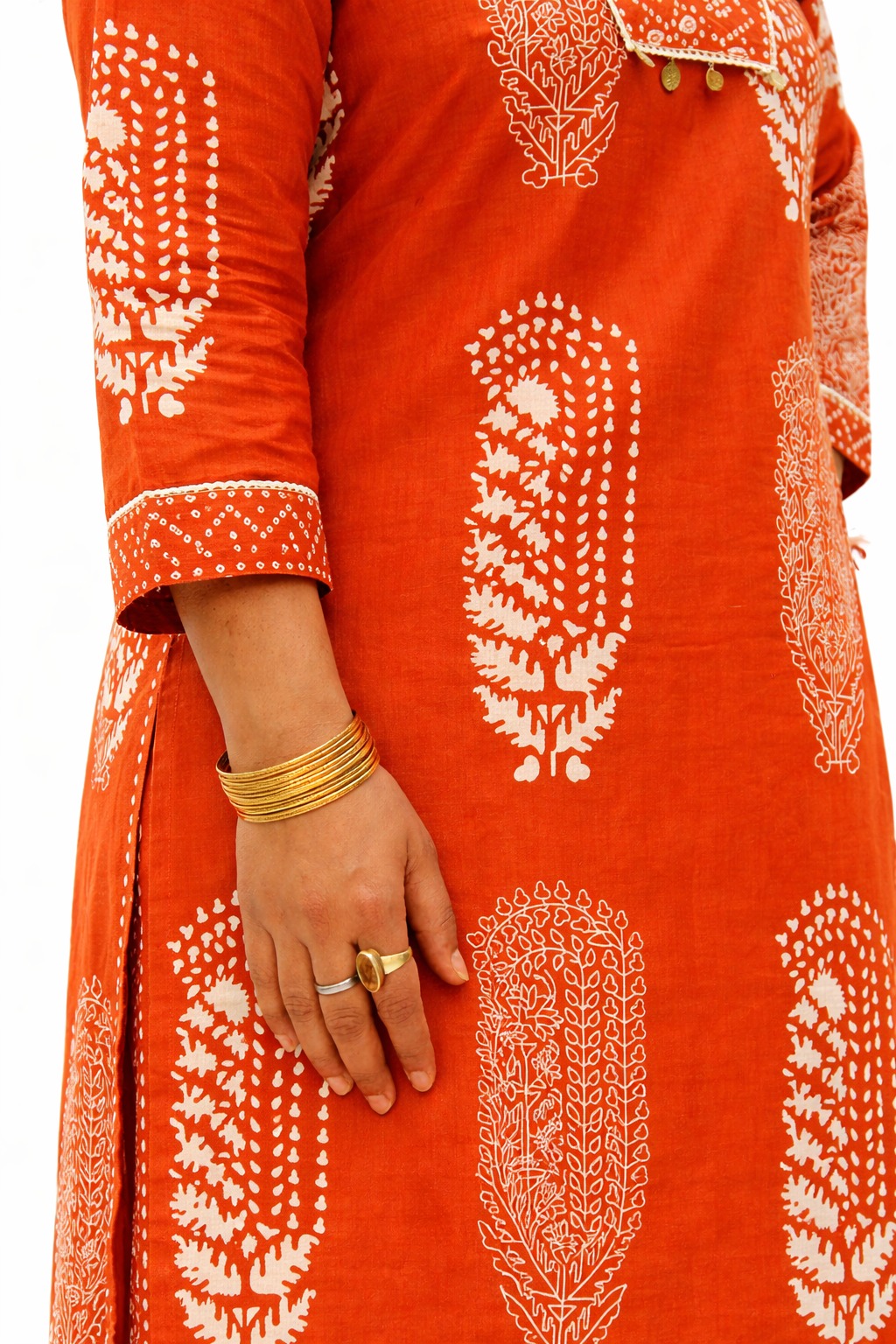 Women’s Rust orange floral motifs cotton printed kurta pant set  | v neck detalling with tussels  | 3/4 Sleeve  | comfortble regular stright fit shillouttle 3