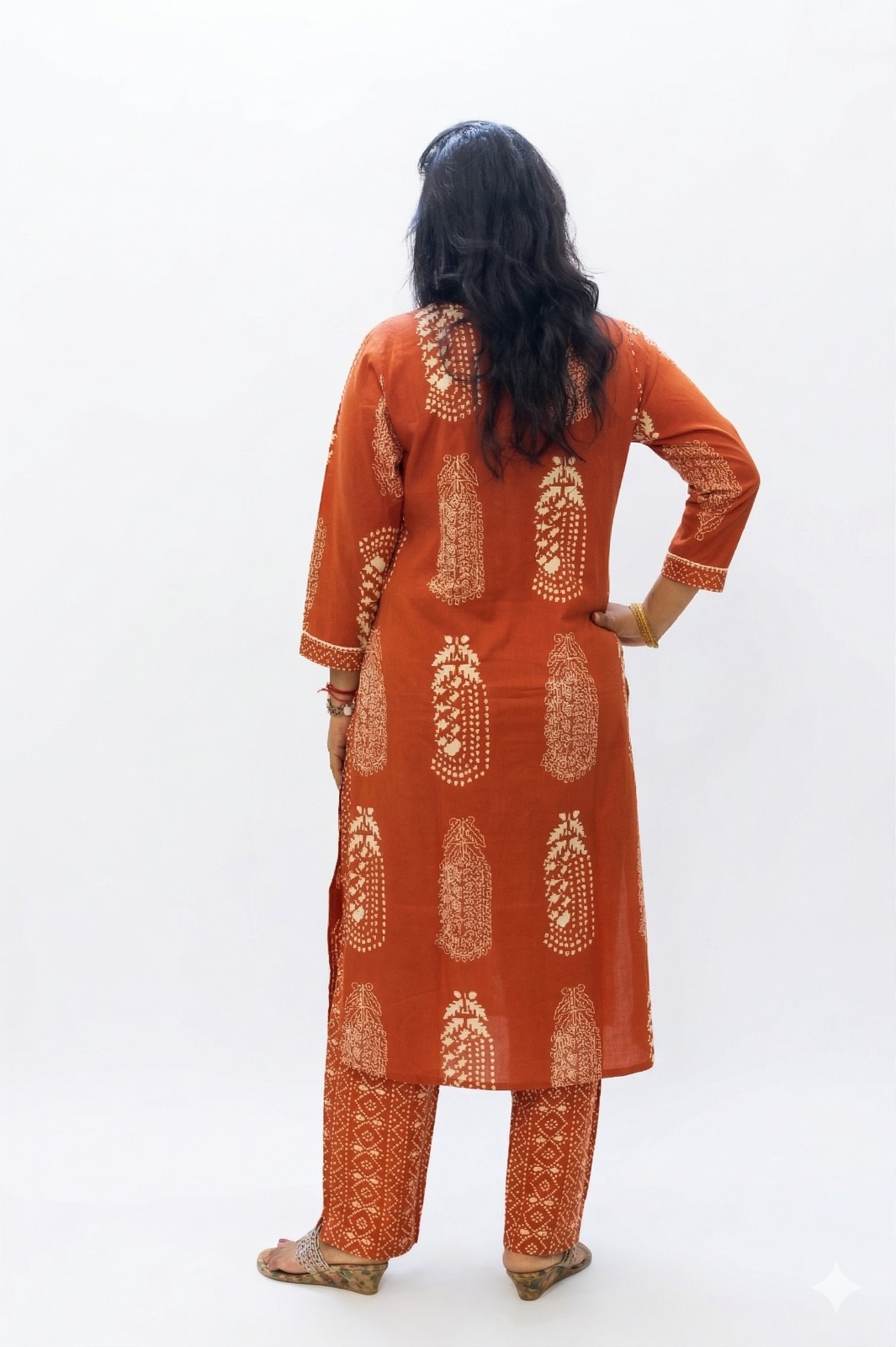 Women’s Rust orange floral motifs cotton printed kurta pant set  | v neck detalling with tussels  | 3/4 Sleeve  | comfortble regular stright fit shillouttle 4
