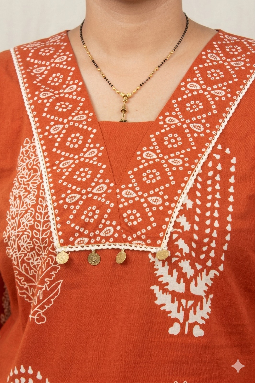 Women’s Rust orange floral motifs cotton printed kurta pant set  | v neck detalling with tussels  | 3/4 Sleeve  | comfortble regular stright fit shillouttle 6